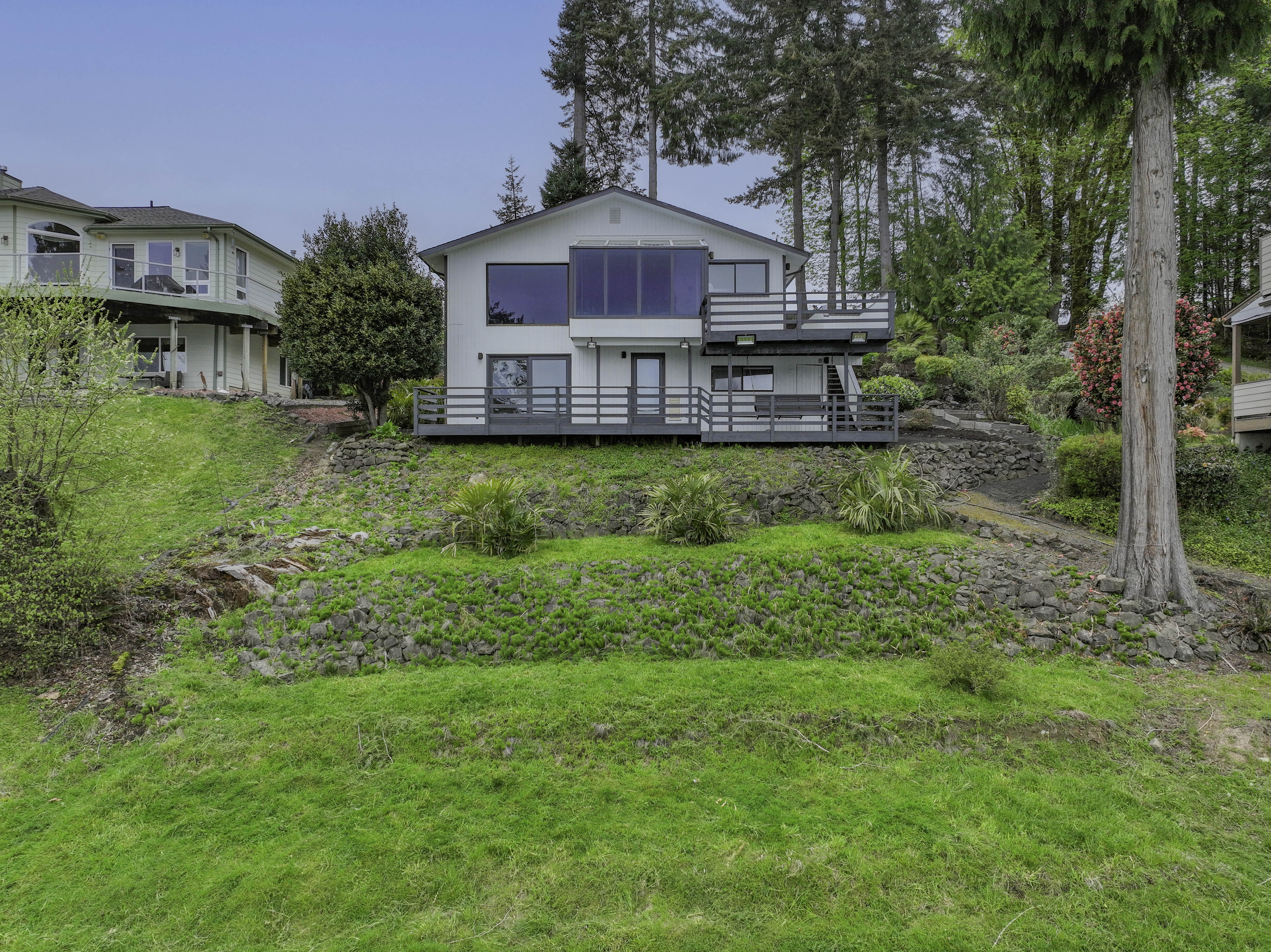 Aerial drone shot of Shelton WA waterfront home with Puget Sound views