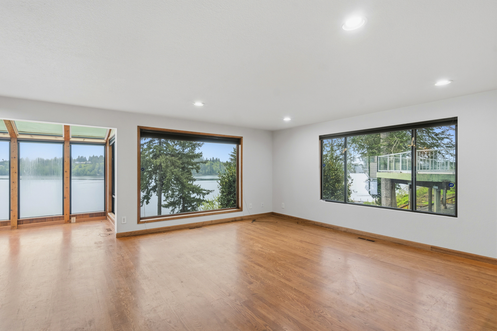 Renovated waterfront interior with Totten Inlet views, hardwood floors and granite kitchen